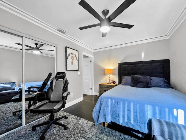 bedroom with crown molding, wood finished floors, ceiling fan, a desk, and baseboards