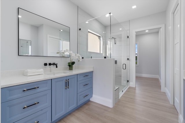 16149 73rd Ter N, West Palm Beach, FL 33418 - bathroom featuring vanity, a marble finish shower, wood finished floors, baseboards, and recessed lighting