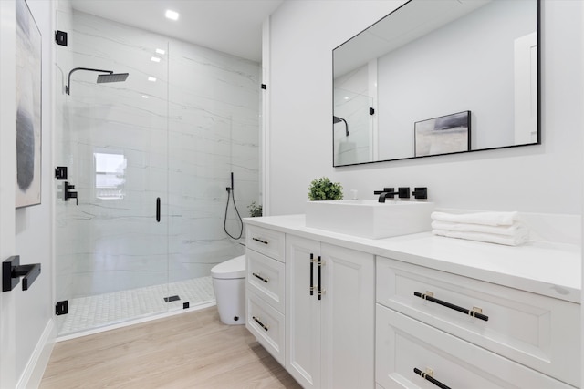 16149 73rd Ter N, West Palm Beach, FL 33418 - bathroom with vanity, a marble finish shower, toilet, wood finished floors, and recessed lighting