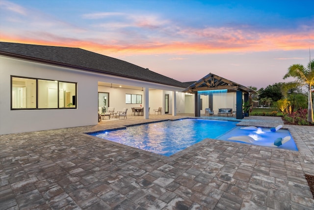16149 73rd Ter N, West Palm Beach, FL 33418 - pool at dusk with an outdoor pool and a patio