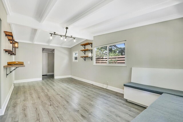 825 Northern Dr, Lake Park, FL 33403 - unfurnished living room featuring wood finished floors, baseboards, and a chandelier