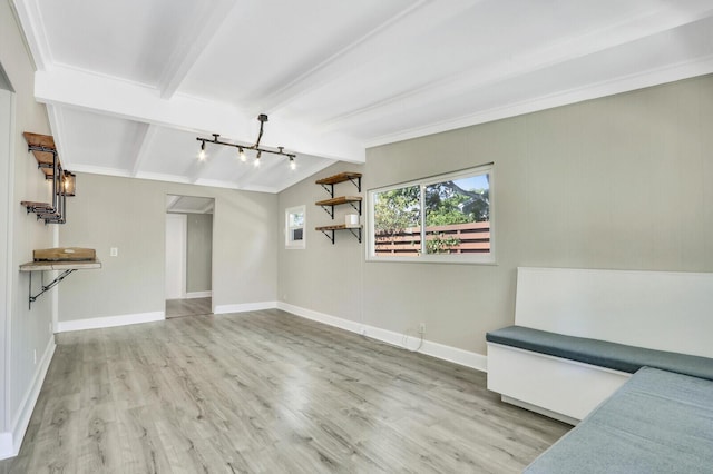 825 Northern Dr, Lake Park, FL 33403 - unfurnished living room featuring wood finished floors, a chandelier, baseboards, and track lighting