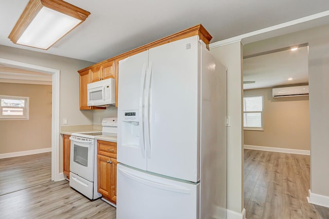 825 Northern Dr, Lake Park, FL 33403 - kitchen with white appliances, an AC wall unit, light wood-style flooring, and light countertops