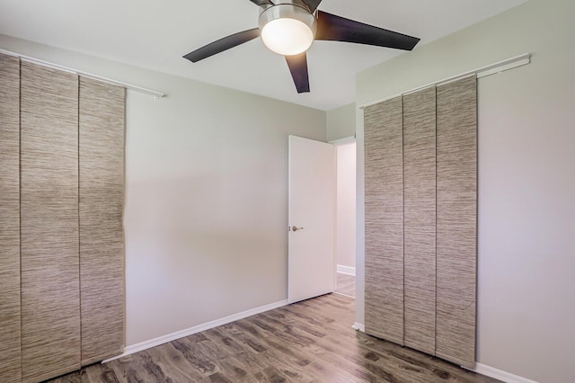 825 Northern Dr, Lake Park, FL 33403 - unfurnished bedroom with wood finished floors, ceiling fan, and a closet