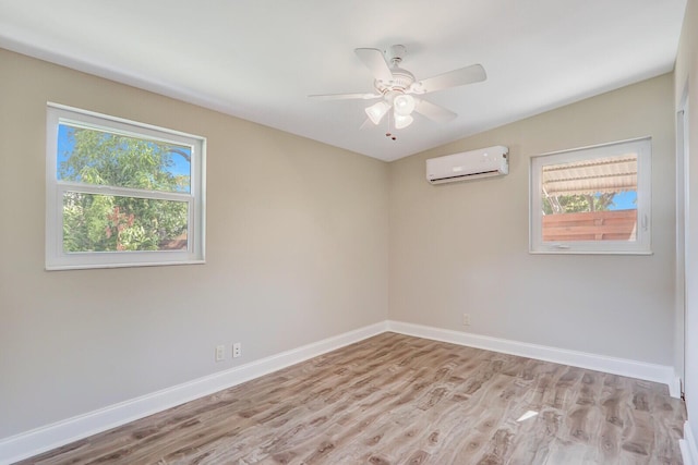 825 Northern Dr, Lake Park, FL 33403 - empty room with a wall unit AC, wood finished floors, healthy amount of natural light, and baseboards