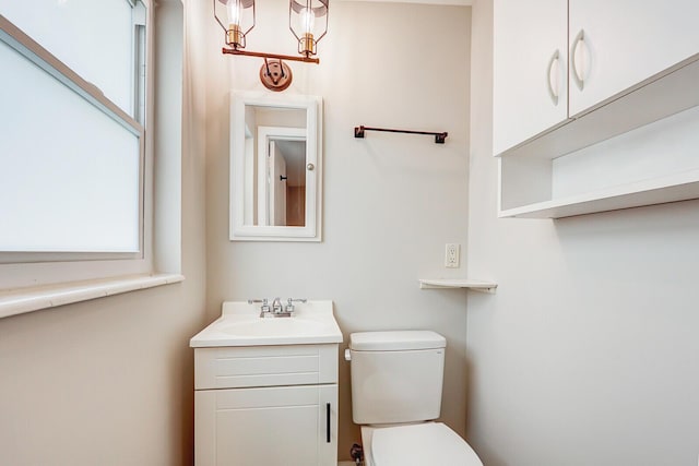 825 Northern Dr, Lake Park, FL 33403 - bathroom with healthy amount of natural light, toilet, and vanity