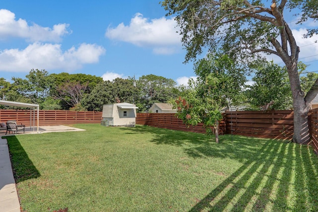 825 Northern Dr, Lake Park, FL 33403 - view of yard with a storage unit, a patio area, and an outdoor structure