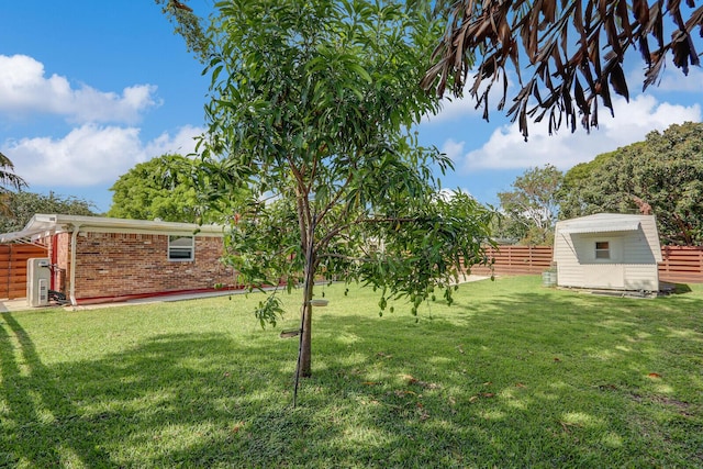 825 Northern Dr, Lake Park, FL 33403 - view of yard featuring an outbuilding and a storage unit