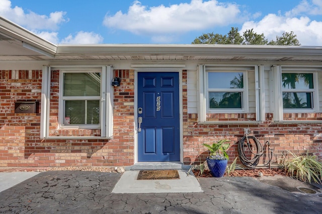 825 Northern Dr, Lake Park, FL 33403 - property entrance with brick siding