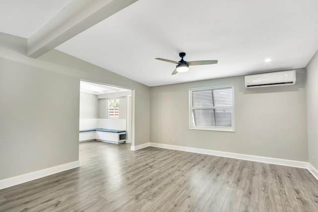 825 Northern Dr, Lake Park, FL 33403 - spare room with a wall mounted air conditioner, a ceiling fan, wood finished floors, baseboards, and recessed lighting