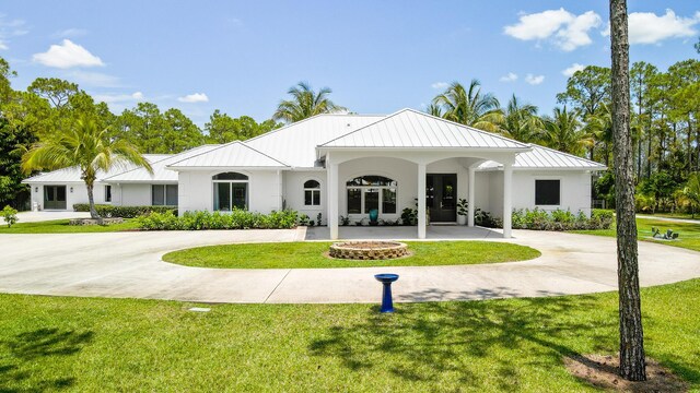 14819 Broken Arrow Pl, Palm Beach Gardens, FL 33418 - view of building exterior with curved driveway