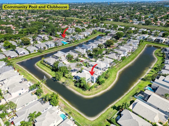 aerial view of property and surrounding area with nearby suburban area and a nearby body of water