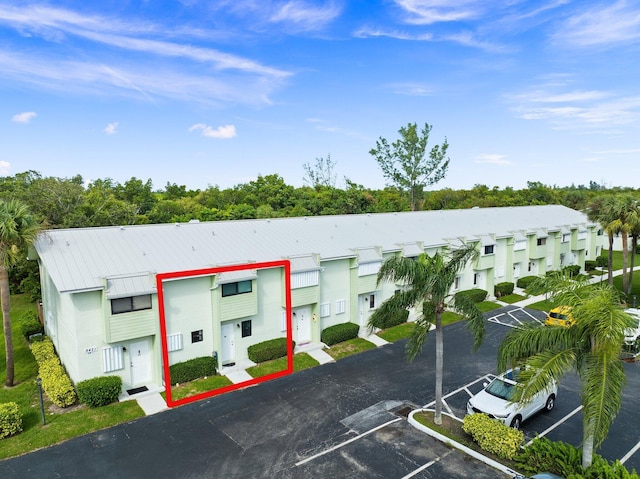 9421 S Ocean Dr Unit 84, Jensen Beach, FL 34957 - view of building exterior with uncovered parking