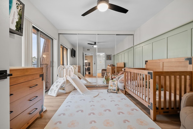 6824 68th Way, West Palm Beach, FL 33409 - bedroom with wood finished floors, a closet, and a ceiling fan