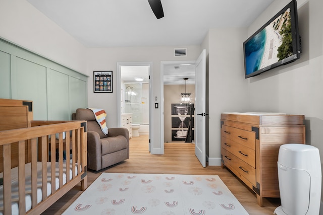 6824 68th Way, West Palm Beach, FL 33409 - bedroom with light wood-style flooring, a closet, baseboards, ceiling fan, and connected bathroom