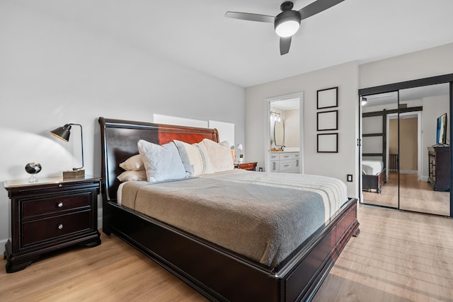 6824 68th Way, West Palm Beach, FL 33409 - bedroom featuring a ceiling fan, ensuite bath, and light wood-style floors