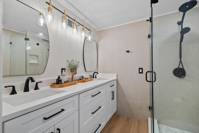 6824 68th Way, West Palm Beach, FL 33409 - bathroom featuring double vanity, a stall shower, and wood finished floors
