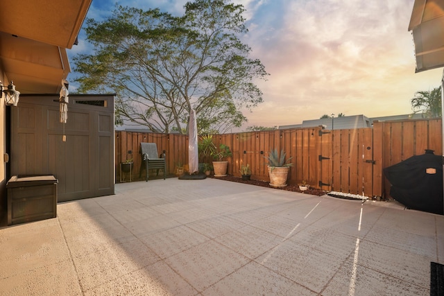 6824 68th Way, West Palm Beach, FL 33409 - patio terrace at dusk featuring a patio area and a fenced backyard