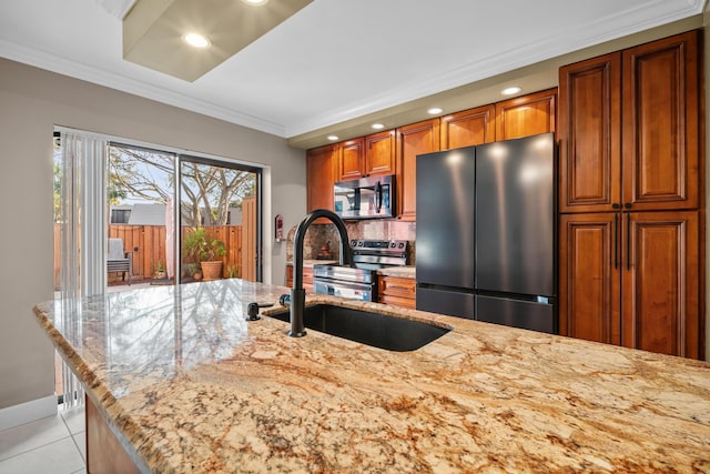 6824 68th Way, West Palm Beach, FL 33409 - kitchen with stainless steel appliances, a sink, brown cabinets, crown molding, and recessed lighting