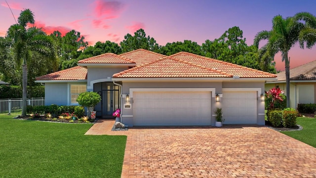 1236 SE Conference Cir, Stuart, FL 34997 - mediterranean / spanish-style home featuring a garage, stucco siding, decorative driveway, and a tiled roof