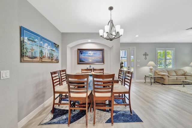 1236 SE Conference Cir, Stuart, FL 34997 - dining area with a chandelier, light wood-style floors, and recessed lighting