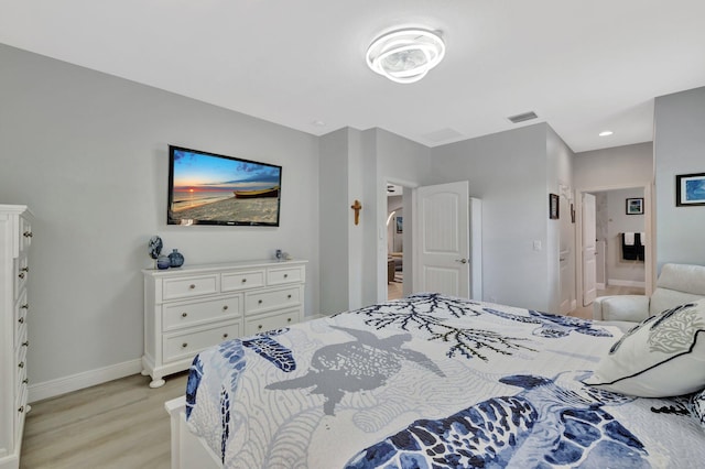 1236 SE Conference Cir, Stuart, FL 34997 - bedroom with baseboards and light wood-type flooring