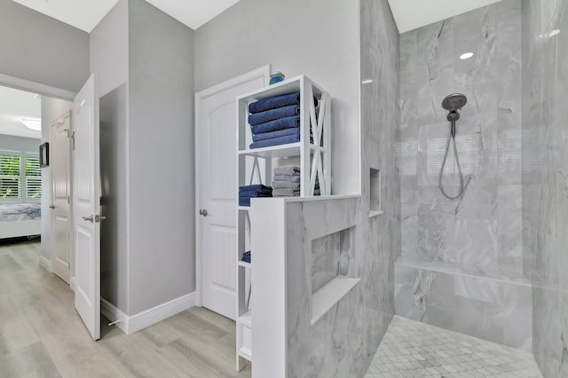1236 SE Conference Cir, Stuart, FL 34997 - ensuite bathroom with a marble finish shower and wood finished floors