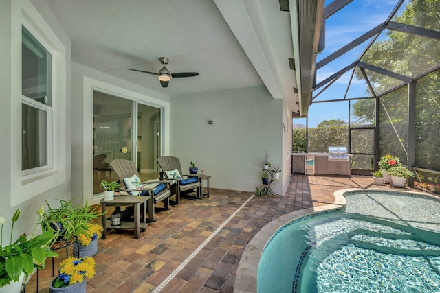 1236 SE Conference Cir, Stuart, FL 34997 - swimming pool featuring an outdoor kitchen, a patio area, ceiling fan, and glass enclosure