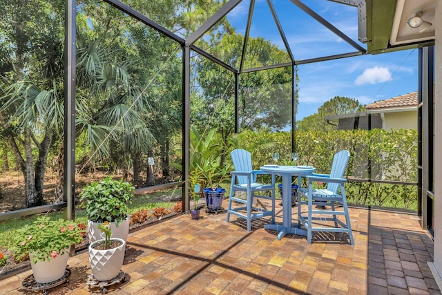 1236 SE Conference Cir, Stuart, FL 34997 - view of patio with a lanai and outdoor dining area