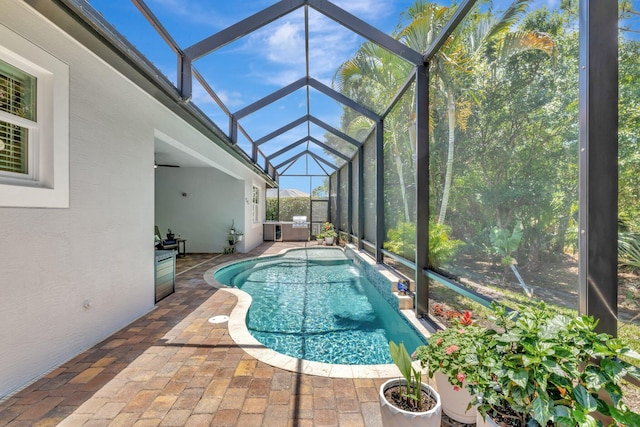 1236 SE Conference Cir, Stuart, FL 34997 - outdoor pool featuring a patio and glass enclosure