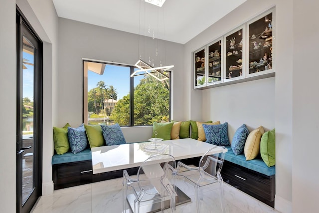 2783 Rhone Dr, Palm Beach Gardens, FL 33410 - dining space with marble finish floors and a chandelier