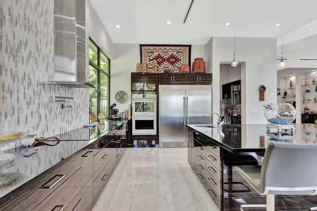 2783 Rhone Dr, Palm Beach Gardens, FL 33410 - kitchen featuring stainless steel built in refrigerator, multiple ovens, a sink, modern cabinets, and light marble finish flooring