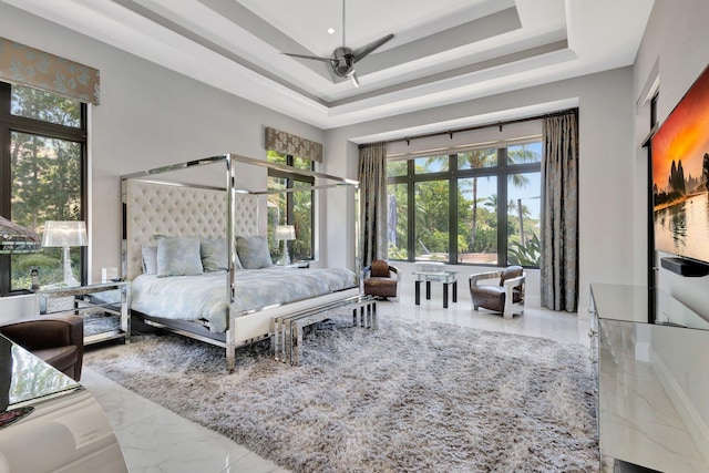 2783 Rhone Dr, Palm Beach Gardens, FL 33410 - bedroom featuring a tray ceiling, marble tiled flooring, and a ceiling fan