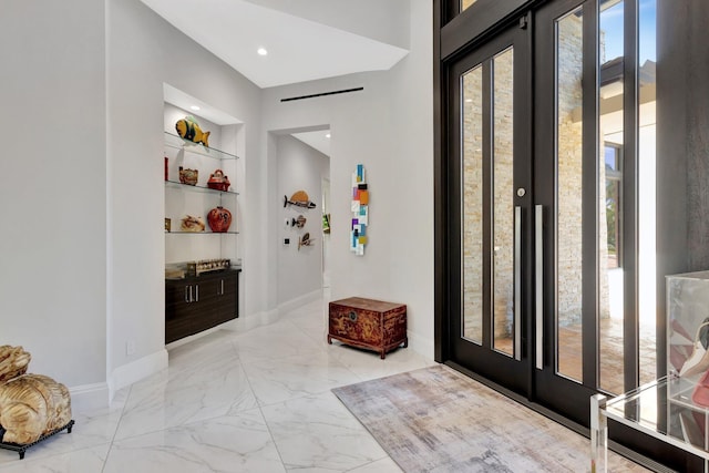 2783 Rhone Dr, Palm Beach Gardens, FL 33410 - foyer featuring light marble finish floors and baseboards