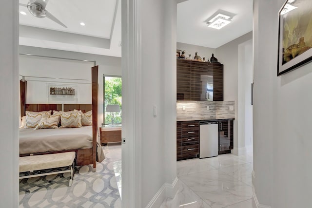 2783 Rhone Dr, Palm Beach Gardens, FL 33410 - bedroom featuring baseboards, wine cooler, light marble finish floors, recessed lighting, and bar area