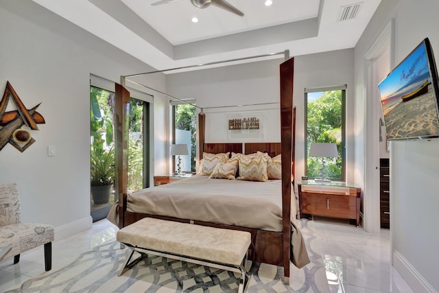 2783 Rhone Dr, Palm Beach Gardens, FL 33410 - bedroom featuring light marble finish flooring, a tray ceiling, recessed lighting, and baseboards
