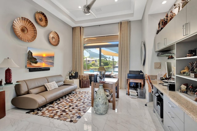 2783 Rhone Dr, Palm Beach Gardens, FL 33410 - home office with a high ceiling, a raised ceiling, light marble finish flooring, and recessed lighting