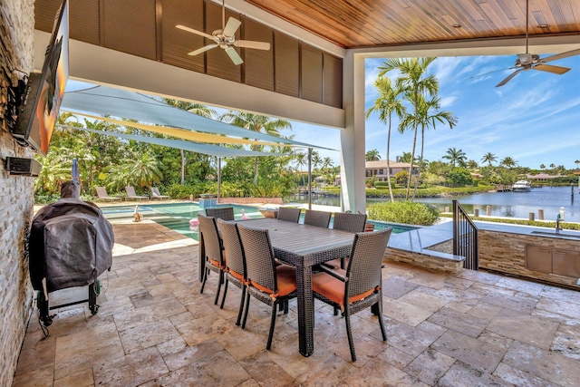 2783 Rhone Dr, Palm Beach Gardens, FL 33410 - view of patio / terrace with a ceiling fan, a water view, an outdoor pool, and outdoor dining space
