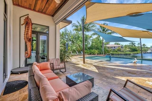 2783 Rhone Dr, Palm Beach Gardens, FL 33410 - view of patio with outdoor lounge area, an outdoor pool, and a water view