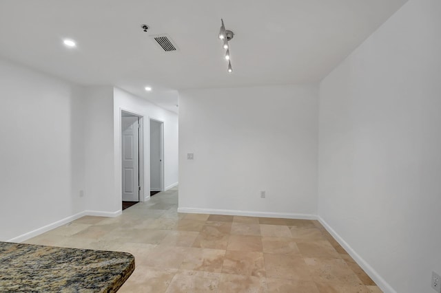 unfurnished room featuring recessed lighting, baseboards, and fire sprinkler in ceiling