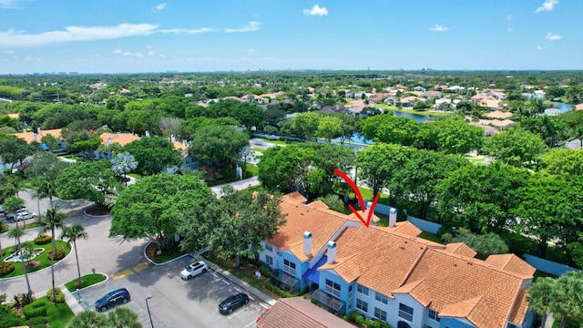 aerial view of residential area with a nearby body of water