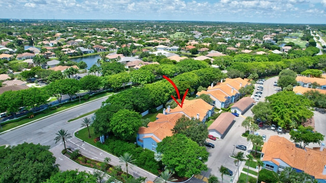 aerial view of property and surrounding area featuring nearby suburban area