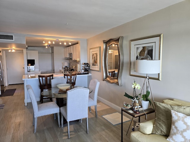 3581 S Ocean Blvd Unit 7C, South Palm Beach, FL 33480 - dining room featuring wood finished floors and baseboards