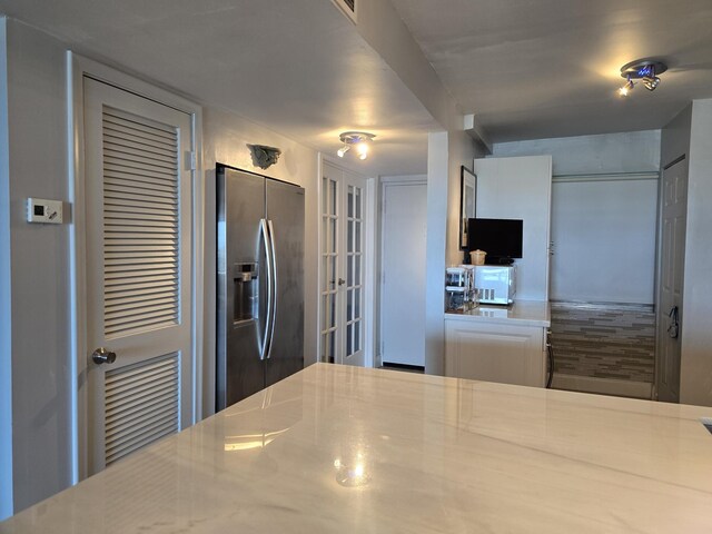 3581 S Ocean Blvd Unit 7C, South Palm Beach, FL 33480 - kitchen with stainless steel fridge with ice dispenser and french doors
