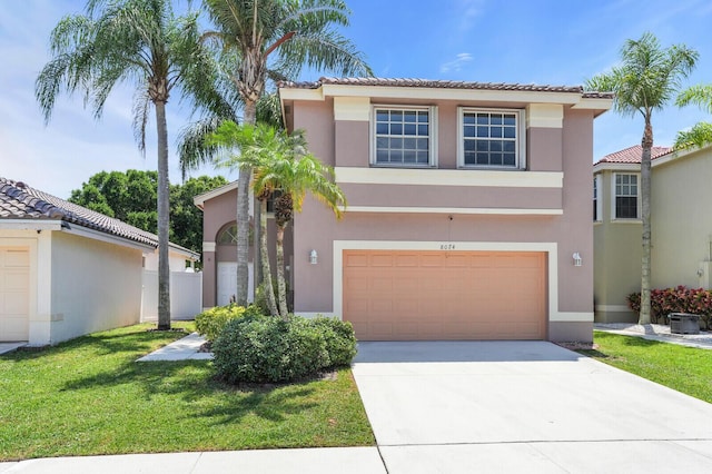 8074 Stirrup Cay Ct, Boynton Beach, FL 33436 - view of front facade featuring stucco siding, an attached garage, driveway, a front lawn, and a tiled roof