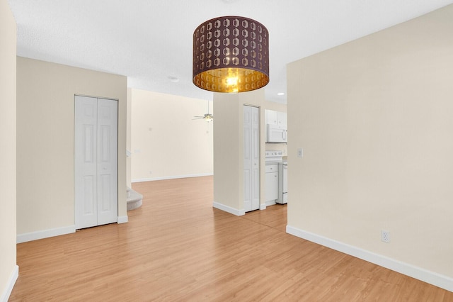 8074 Stirrup Cay Ct, Boynton Beach, FL 33436 - spare room with light wood-style flooring, baseboards, and ceiling fan