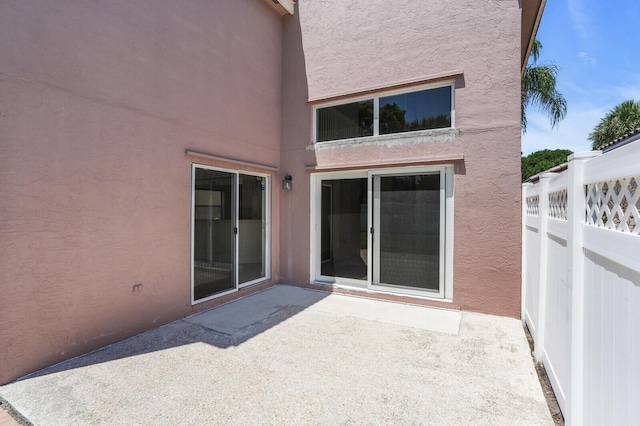 8074 Stirrup Cay Ct, Boynton Beach, FL 33436 - rear view of property featuring stucco siding and a patio