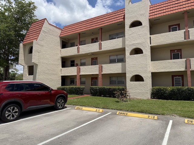 2950 Sunrise Lakes Dr W Unit 101, Sunrise, FL 33322 - view of apartment building / complex with uncovered parking