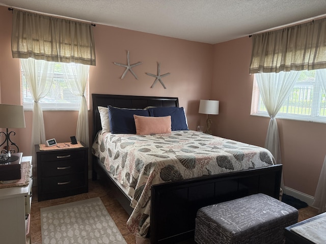 2950 Sunrise Lakes Dr W Unit 101, Sunrise, FL 33322 - bedroom featuring a textured ceiling