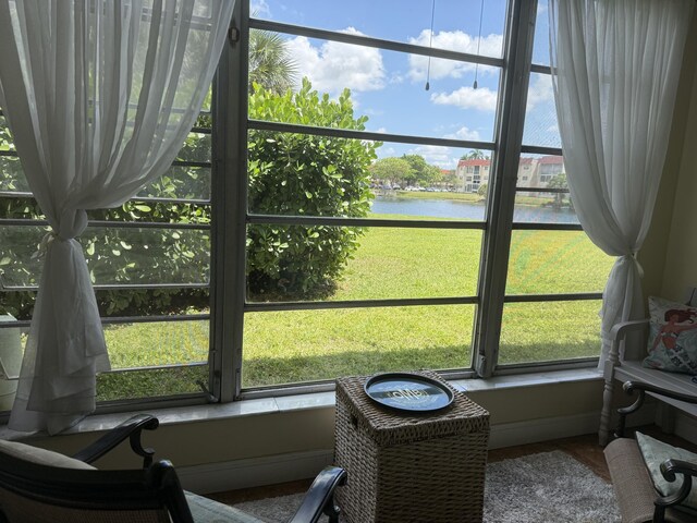 2950 Sunrise Lakes Dr W Unit 101, Sunrise, FL 33322 - sunroom / solarium featuring a water view and plenty of natural light